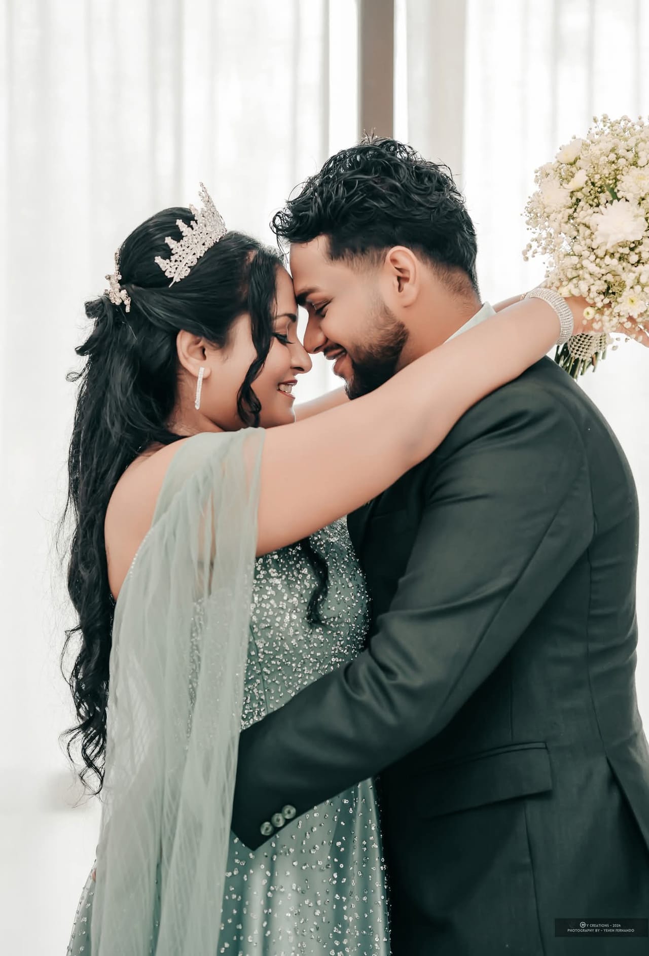 A bride and groom holding each other closely during their portraits